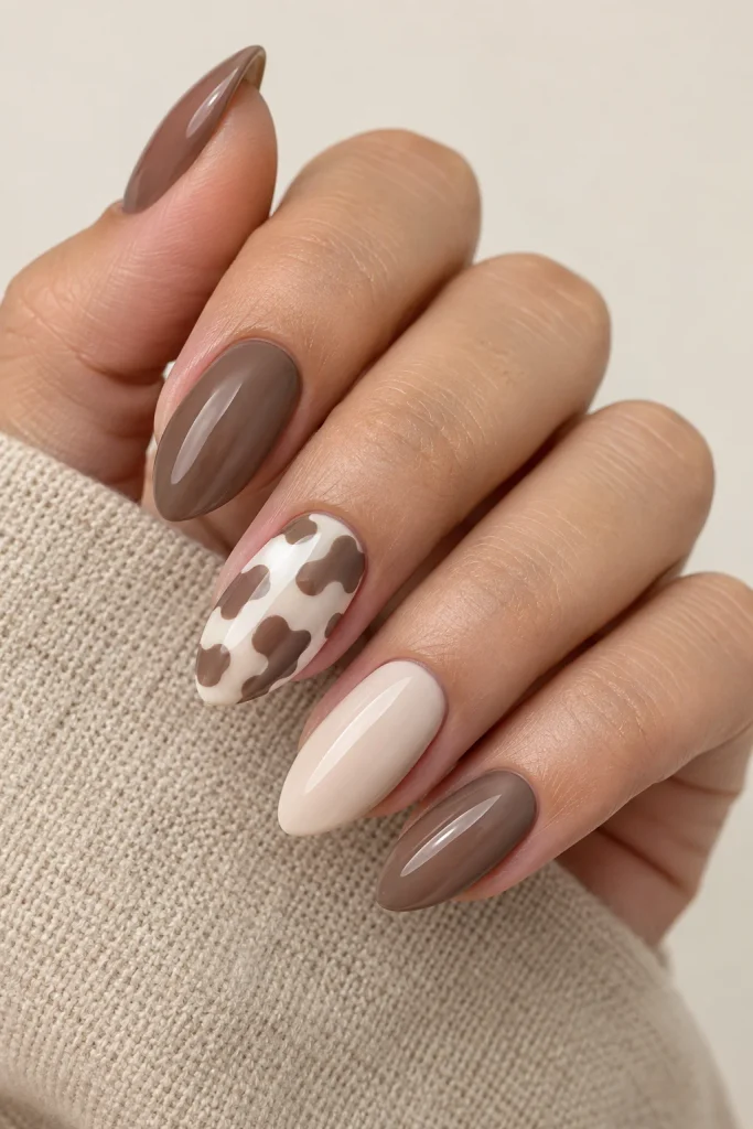 Soft brown cow print accent on white nails