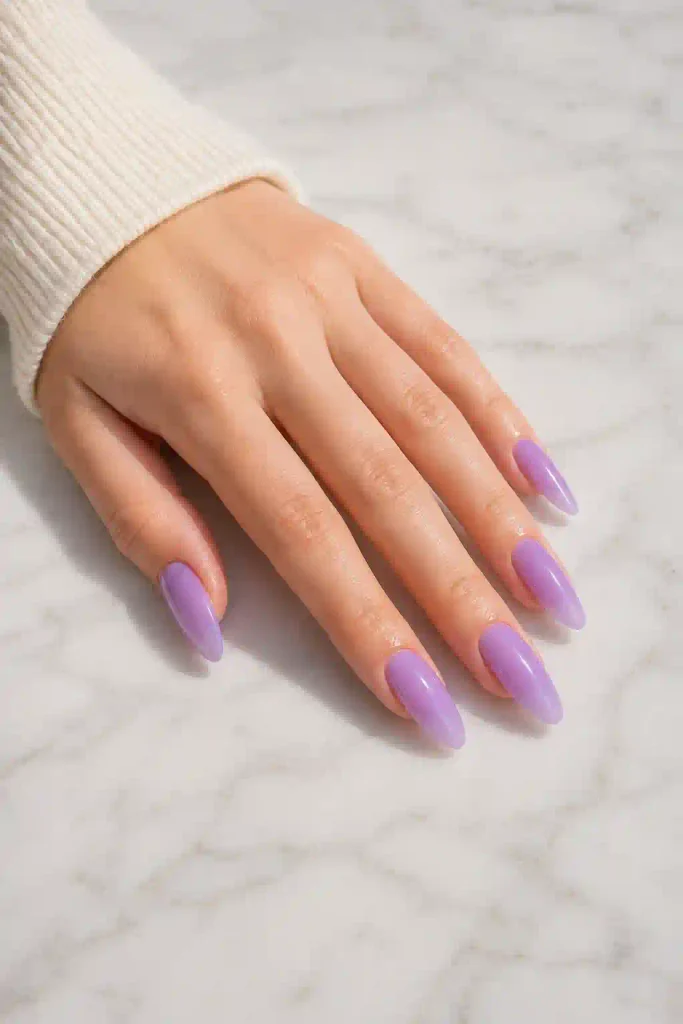 Long almond nails with soft translucent lavender jelly polish
