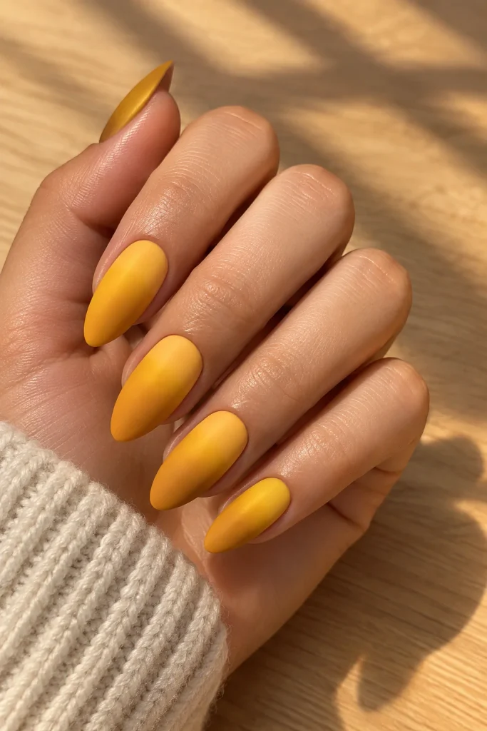 Sunflower yellow to mustard ombre almond nails