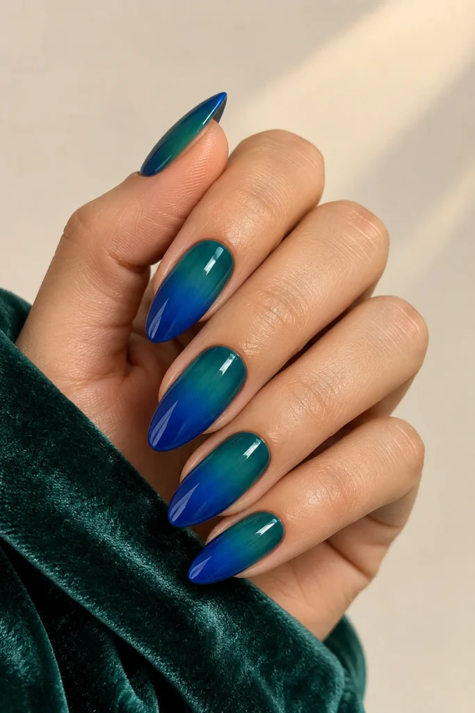 Deep teal and royal blue ombre almond nails