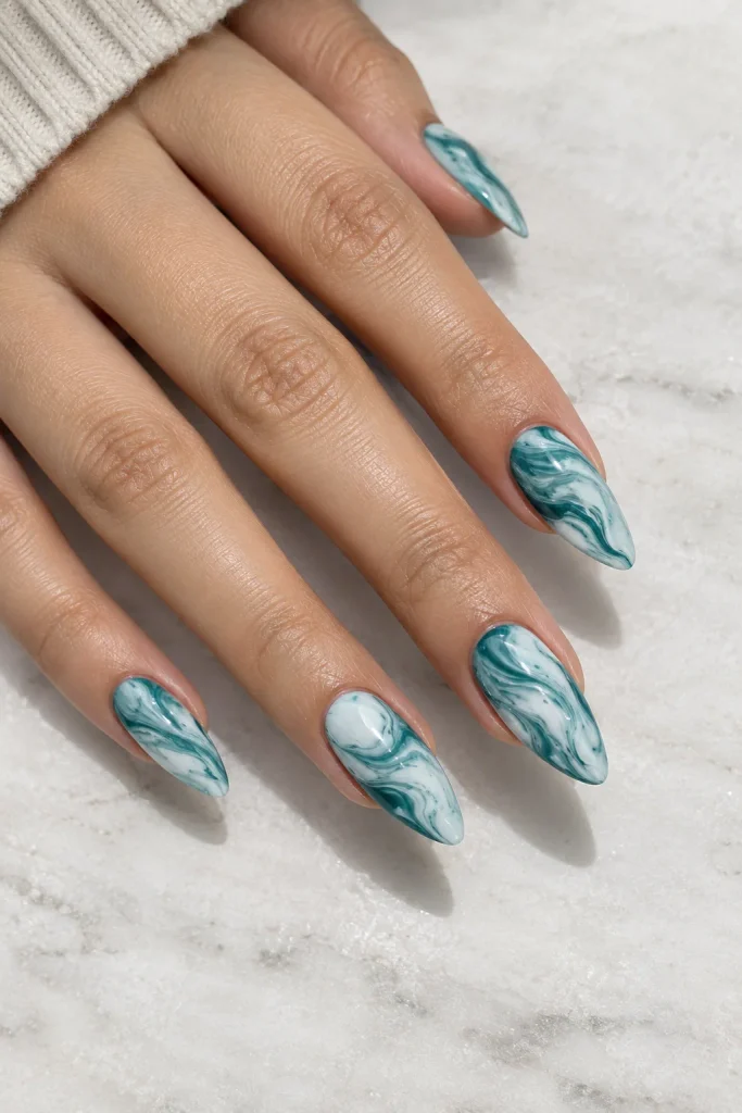 Teal and white marble swirl almond nails