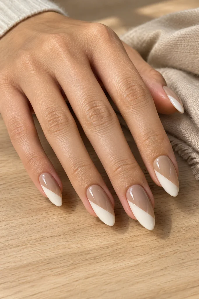 Two-tone neutral almond nails with clean lines