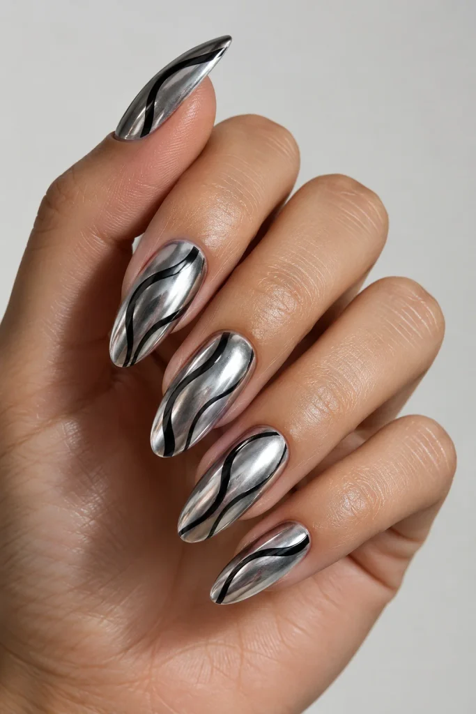 Chrome nails featuring soft wavy black line details