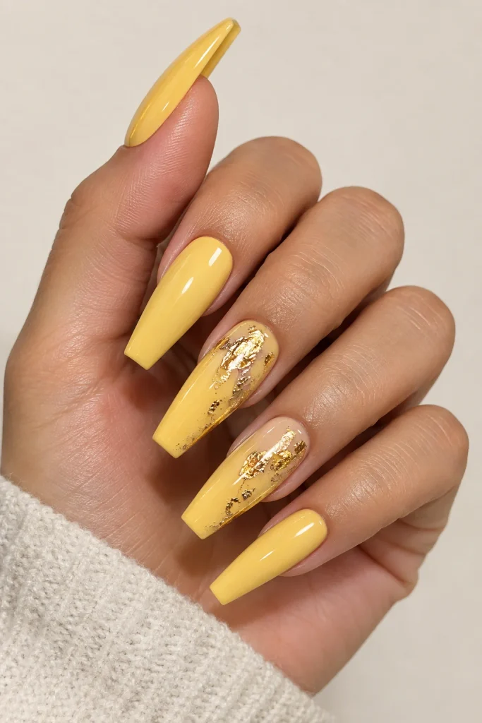 Yellow coffin nails with delicate gold foil accents