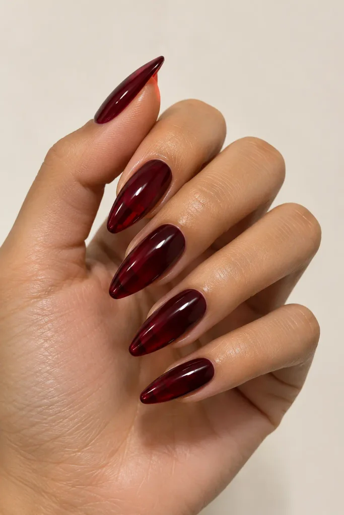 Glossy burgundy jelly nails with translucent wine red color