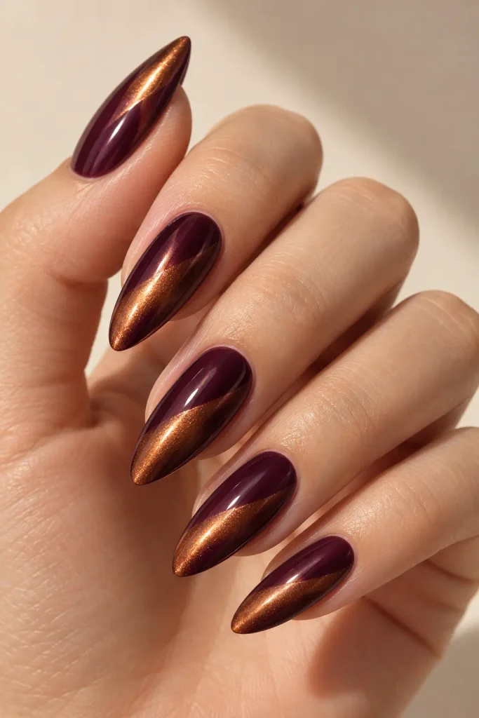 Copper chrome nails layered over a deep plum base