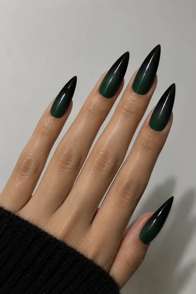 Forest green ombre nails fading into dramatic black tips