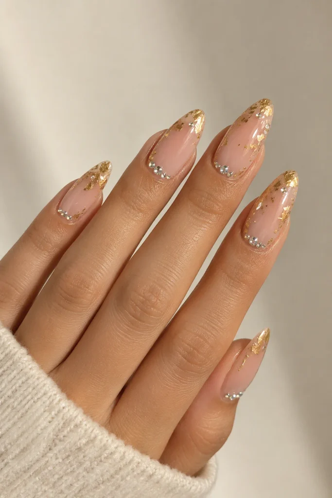 Gilded nude nails with crystals and gold leaf accents