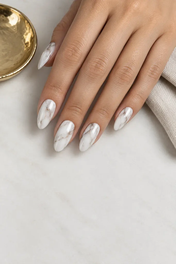 White marble nails with delicate taupe and gray veins